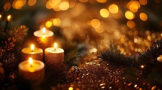 Glittery gold candles and pine branches with holiday lights and bokeh in a festive setting