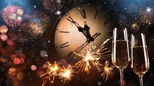 New Year celebration with fireworks, clock nearing midnight, and two champagne glasses