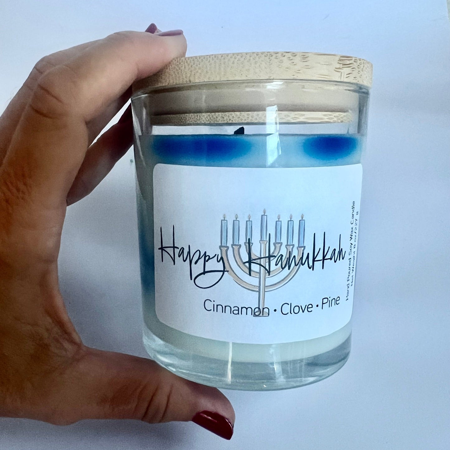 Hanukkah soy candle perfect for the celebration of lights to bring the scent of fir, pine and cinnamon into your home for the holiday season